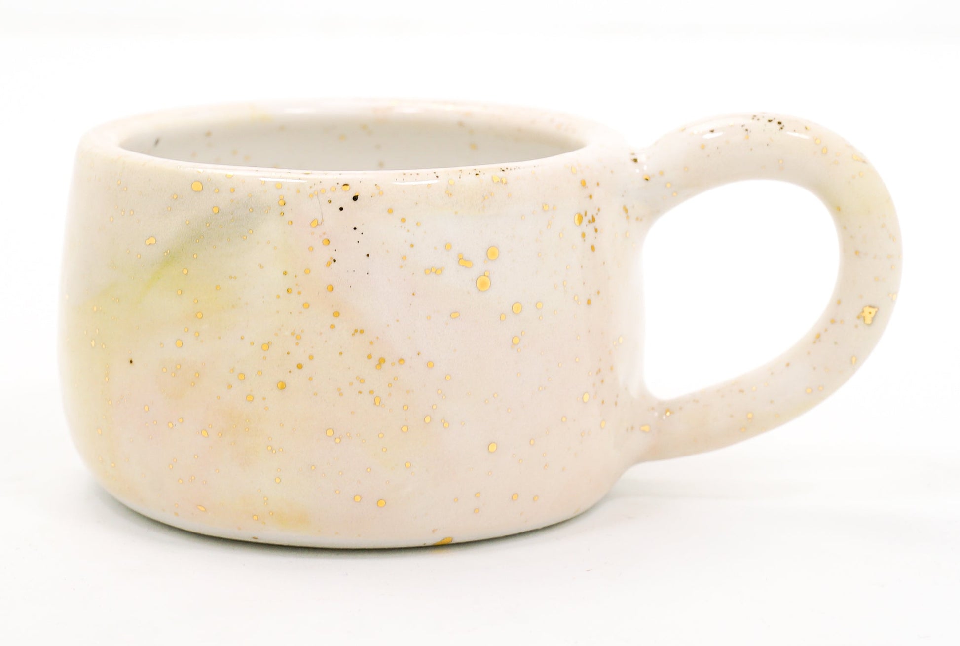 Speckled ceramic mug on a white background