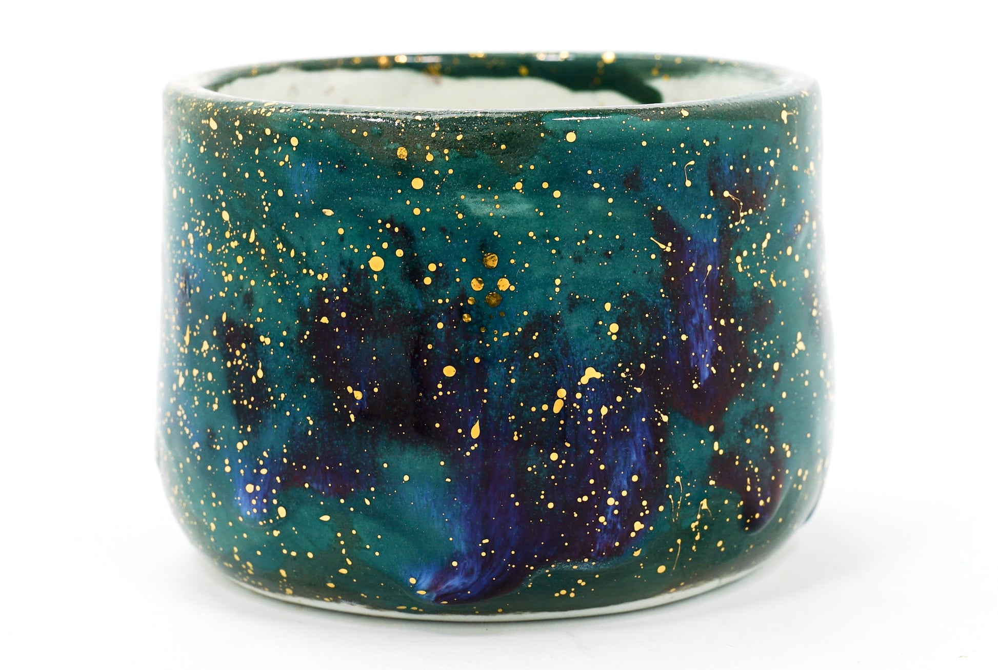 Ceramic mug with galaxy design on a white background