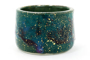 Ceramic mug with a galaxy design on a white background